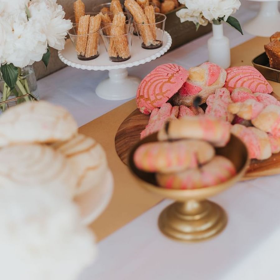 Colorful array of traditional Mexican desserts on a wedding dessert table