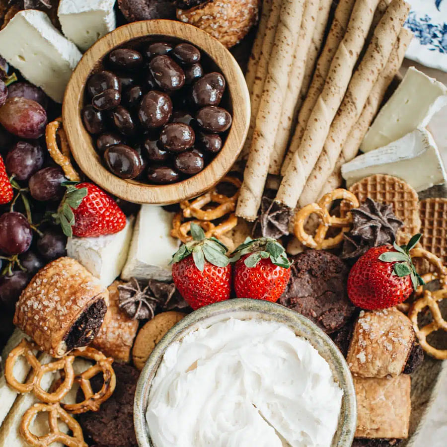 Dessert charcuterie board filled with cream cheese-based treats